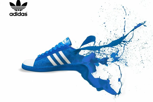 Blue adidas sneakers and paint