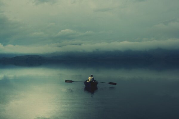 A boatman alone at sea