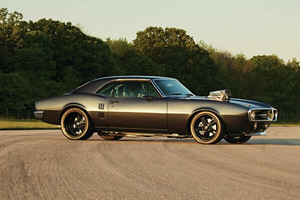 Classic black retro car on the road