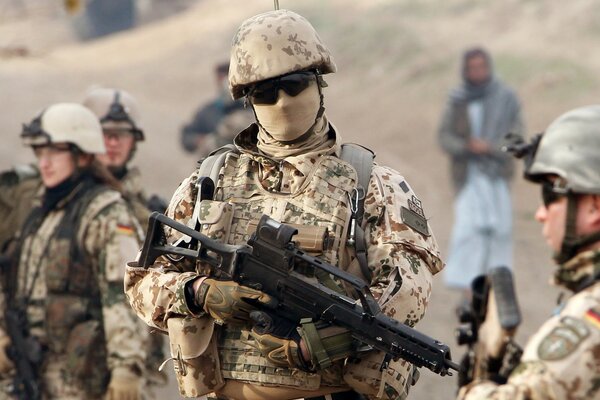 A group of armed soldiers in camouflage