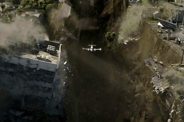 A plane on the background of a destroyed city