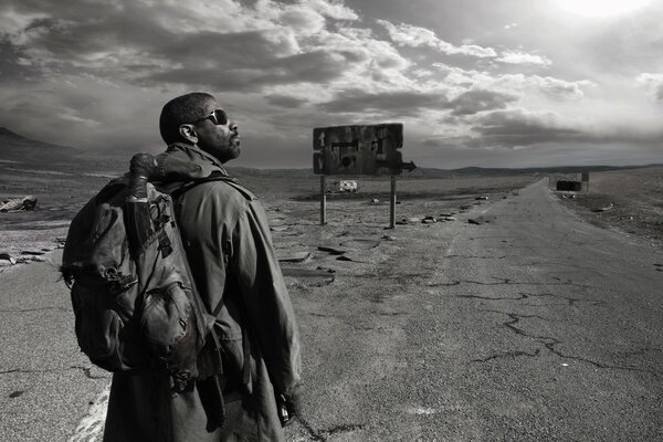 Denzel Washington is standing on the road