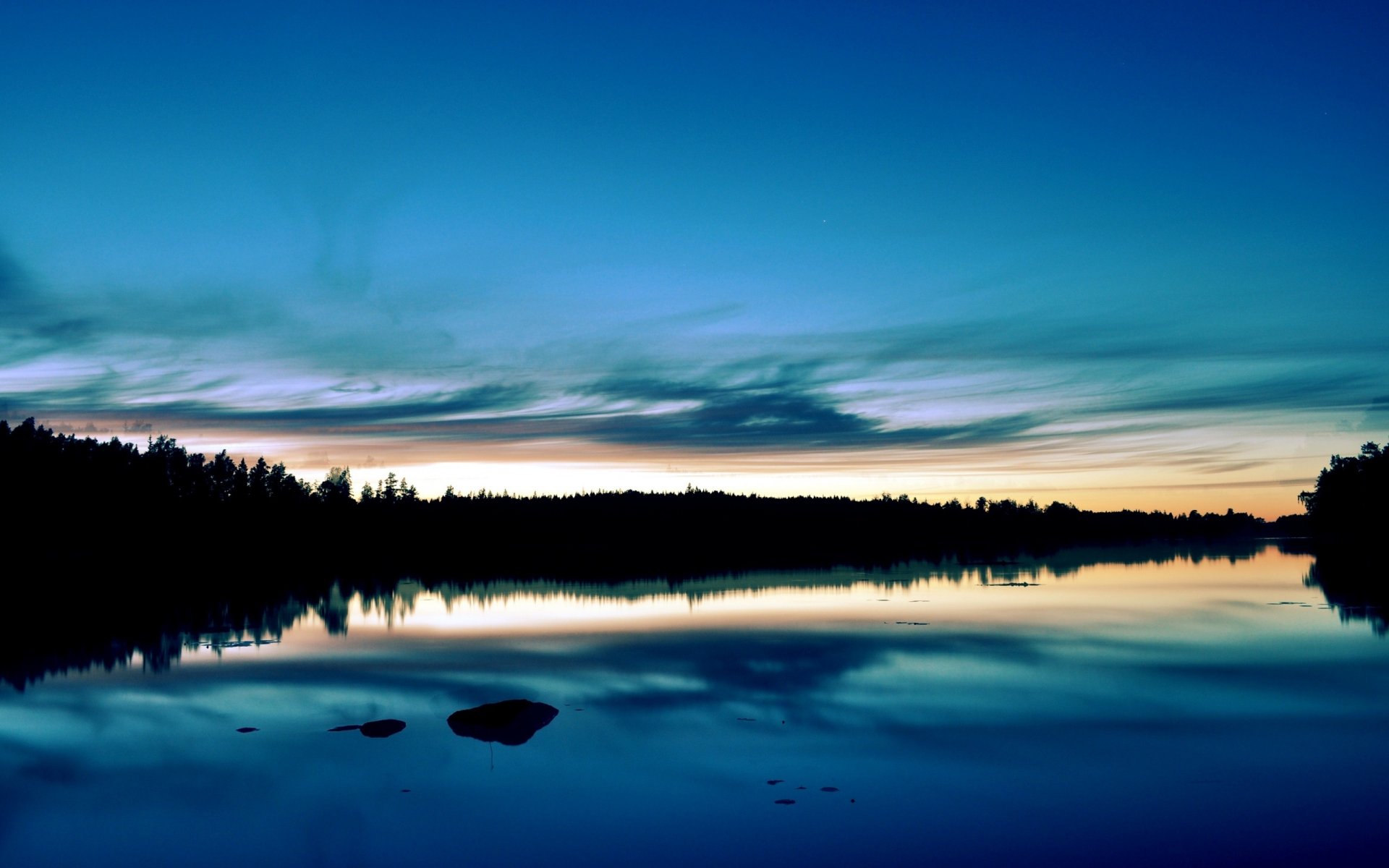 puesta de sol bosque lago