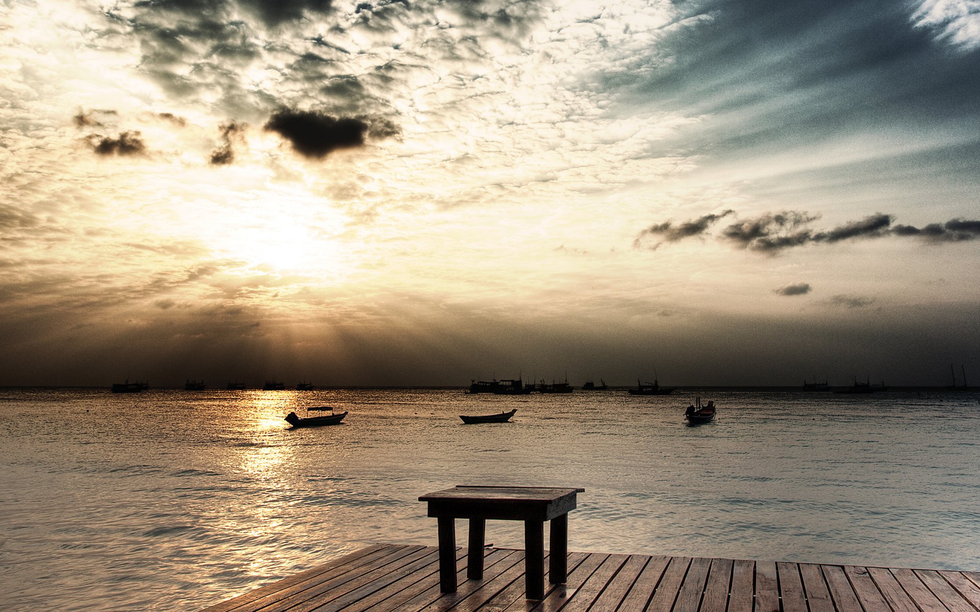 nature landscape . sea waves boat pier wharf sky sun ray