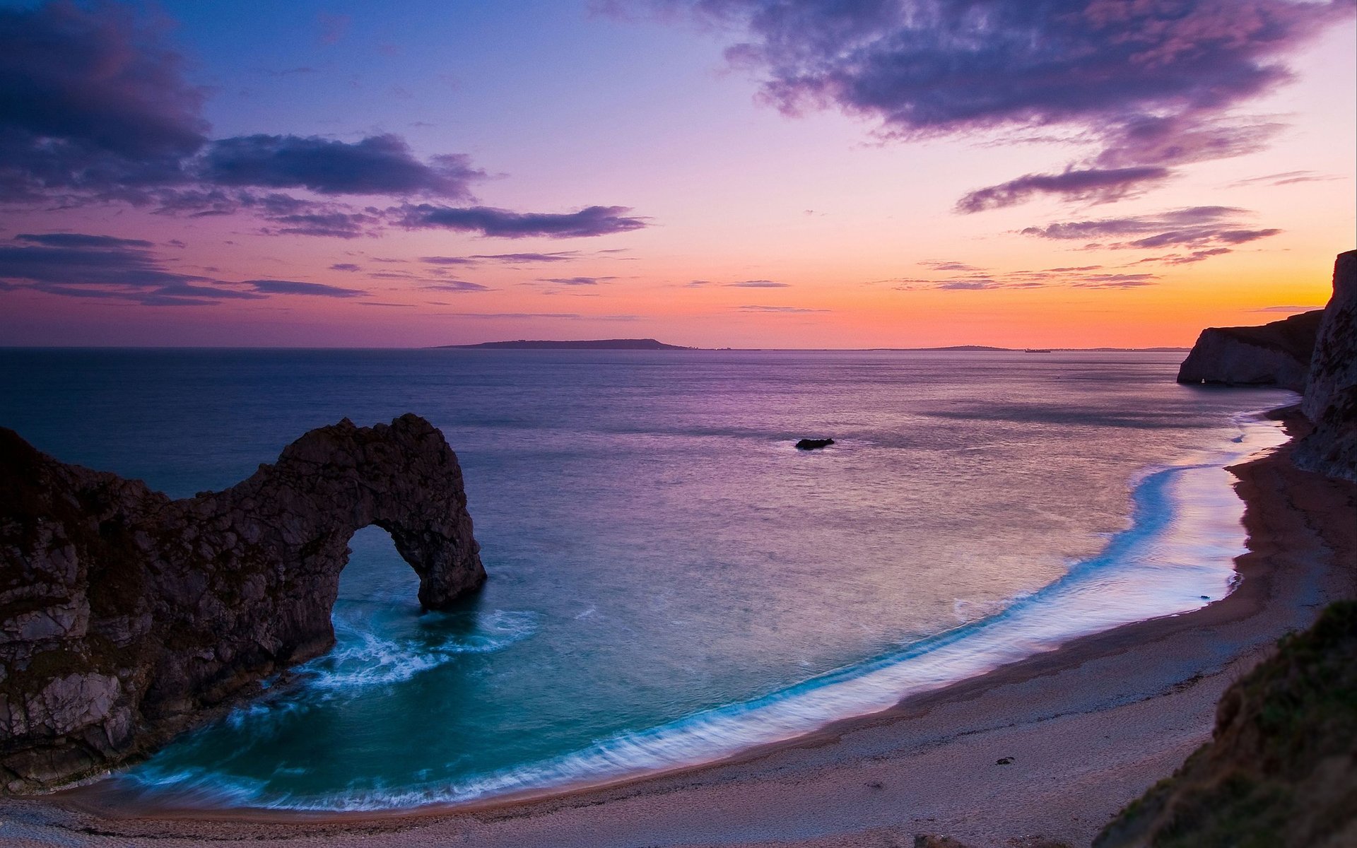 paesaggio natura mare oceano acqua costa cielo costa ciottoli roccia rocce arco archi sera