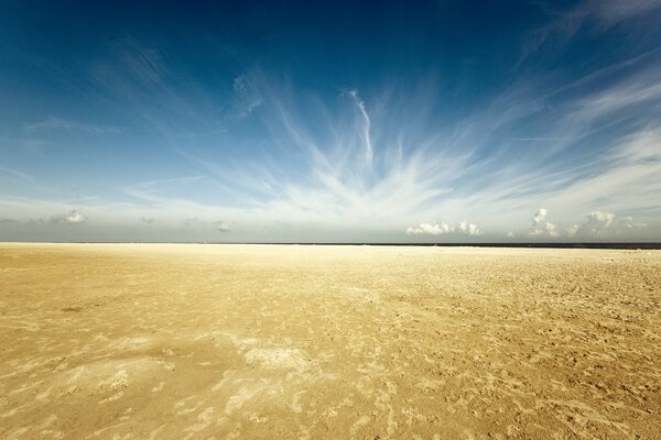 Sandy beach with blue sky