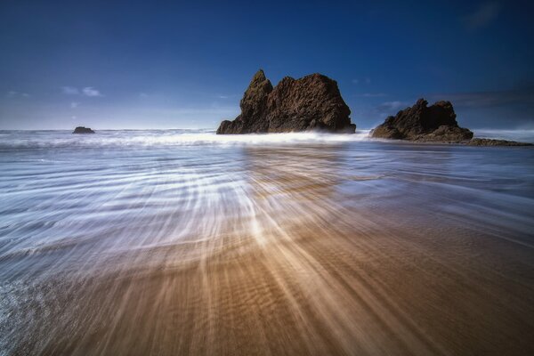 Lonely rocks among the blue sea