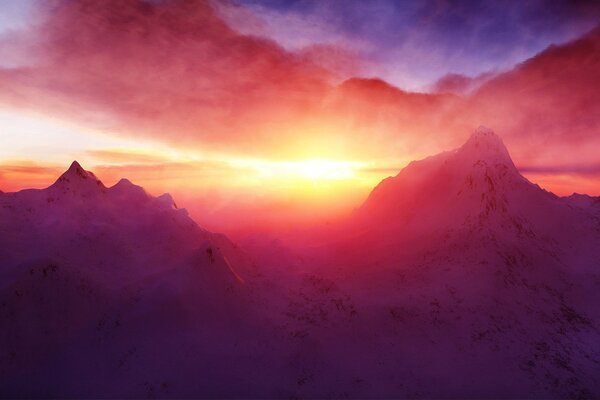 Sunset in the mountains above the horizon