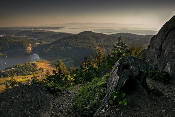 Panorama of the rocky and mountainous landscape. Grey horizon