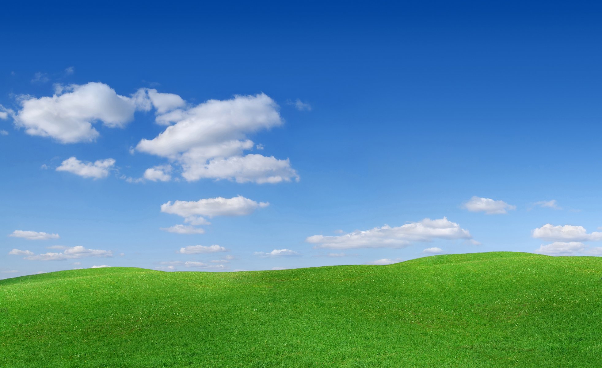 paysage herbe ciel nuages nature collines pentes buttes photo