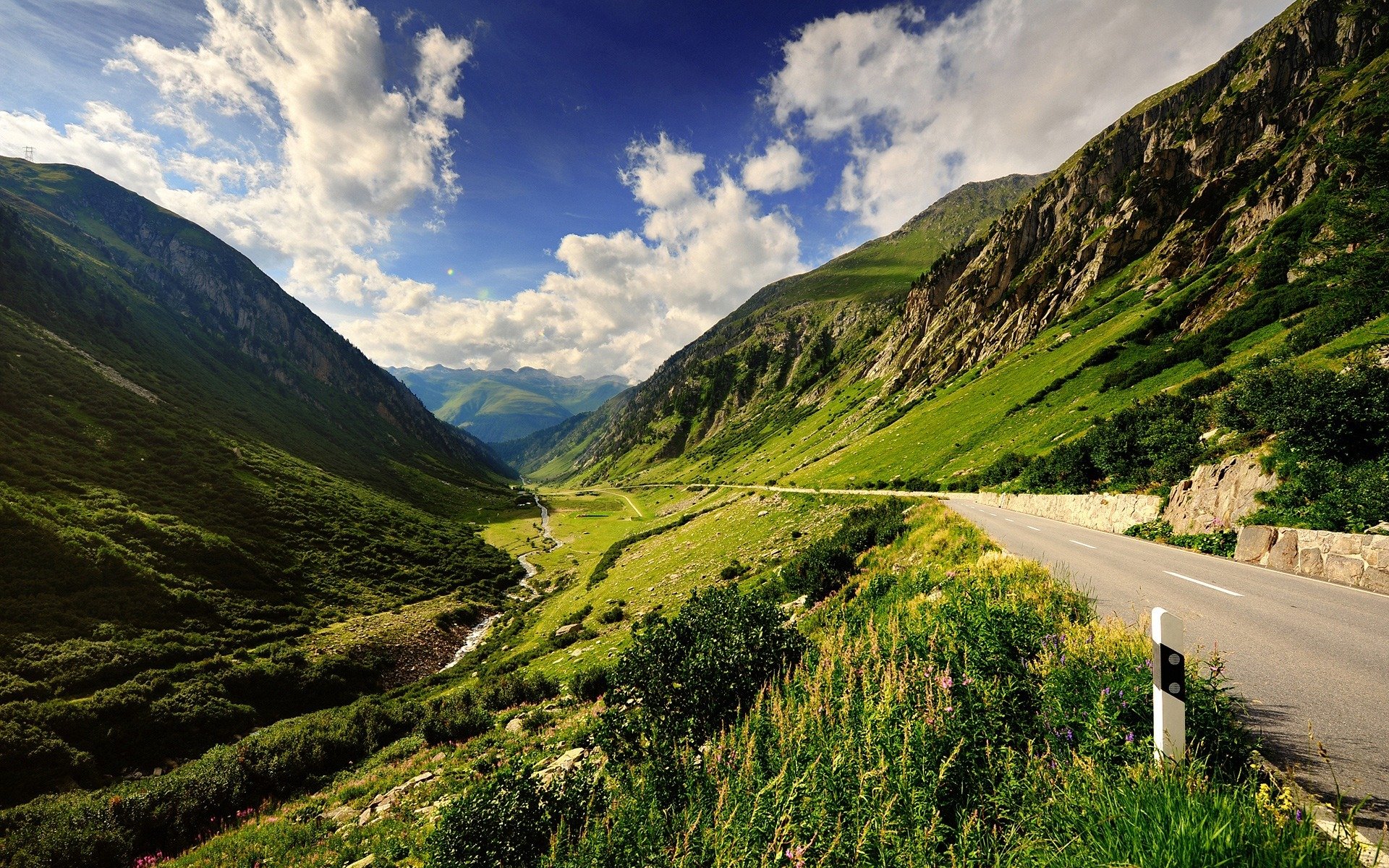 mountain road mountain the way post green nature sky clouds landscape nature walls road