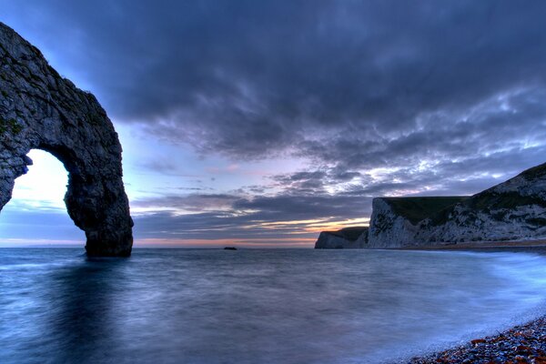 Rocks and sea against a frowning sky