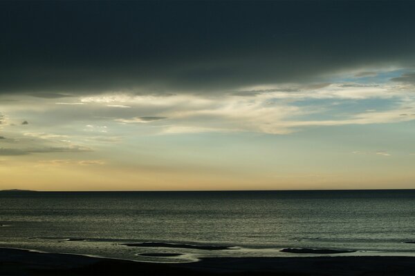 Grey clouds over the quiet sea