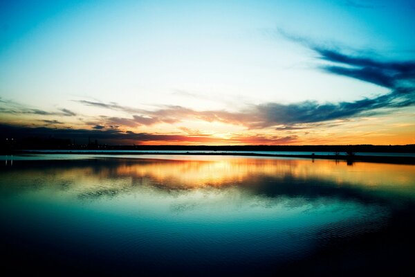 Amazing sunset on the shore of a mountain lake