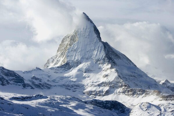 Mountains in the clouds. Winter landscape