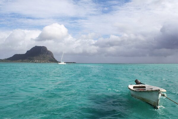 Rocks, sea, sky and boat