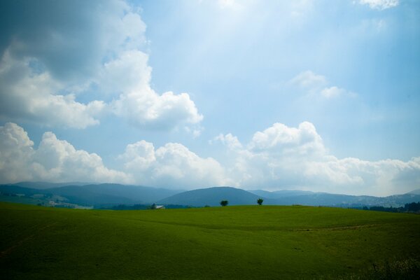 The blue sky stretches over the hills