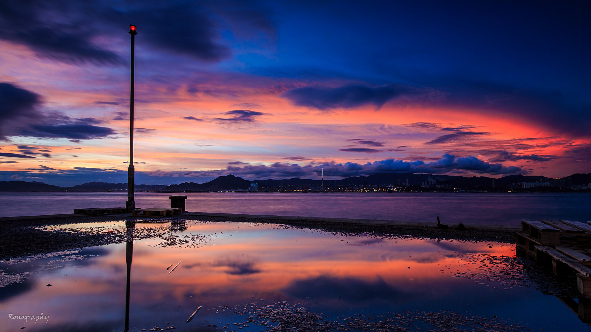 amanecer océano montañas ciudad muelle