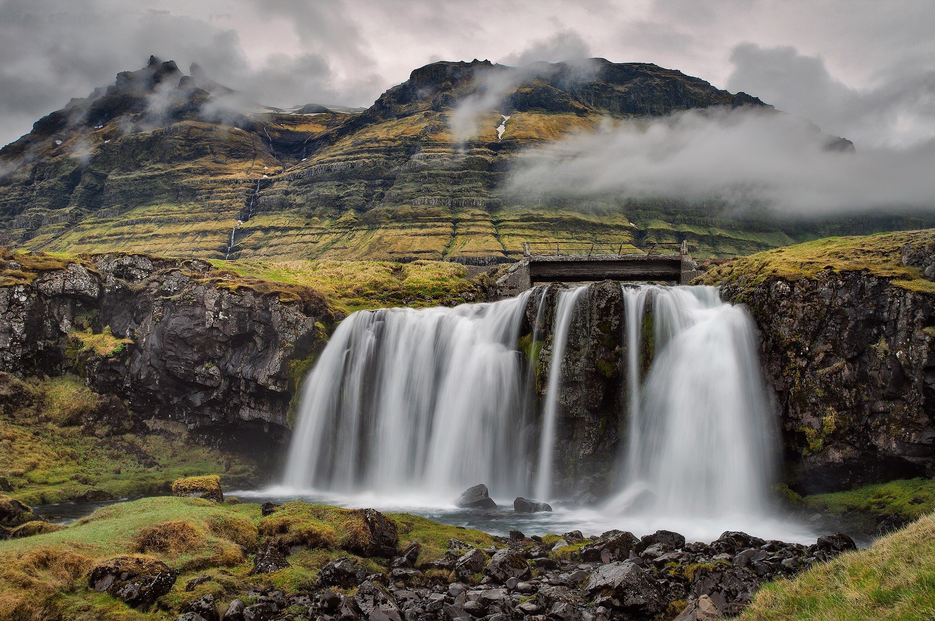 kirkjufell iceland sky clouds mountain waterfall stone