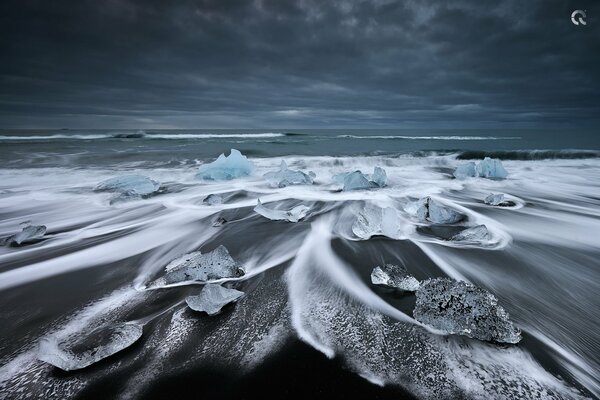 Frozen glacial lagoon on the beach