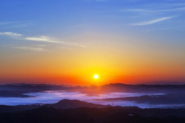 Low mountains at evening sunset