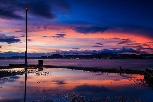 Ocean shore in the evening with a lantern