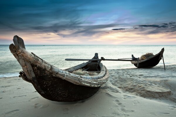 Sea and sand and boats on the shore