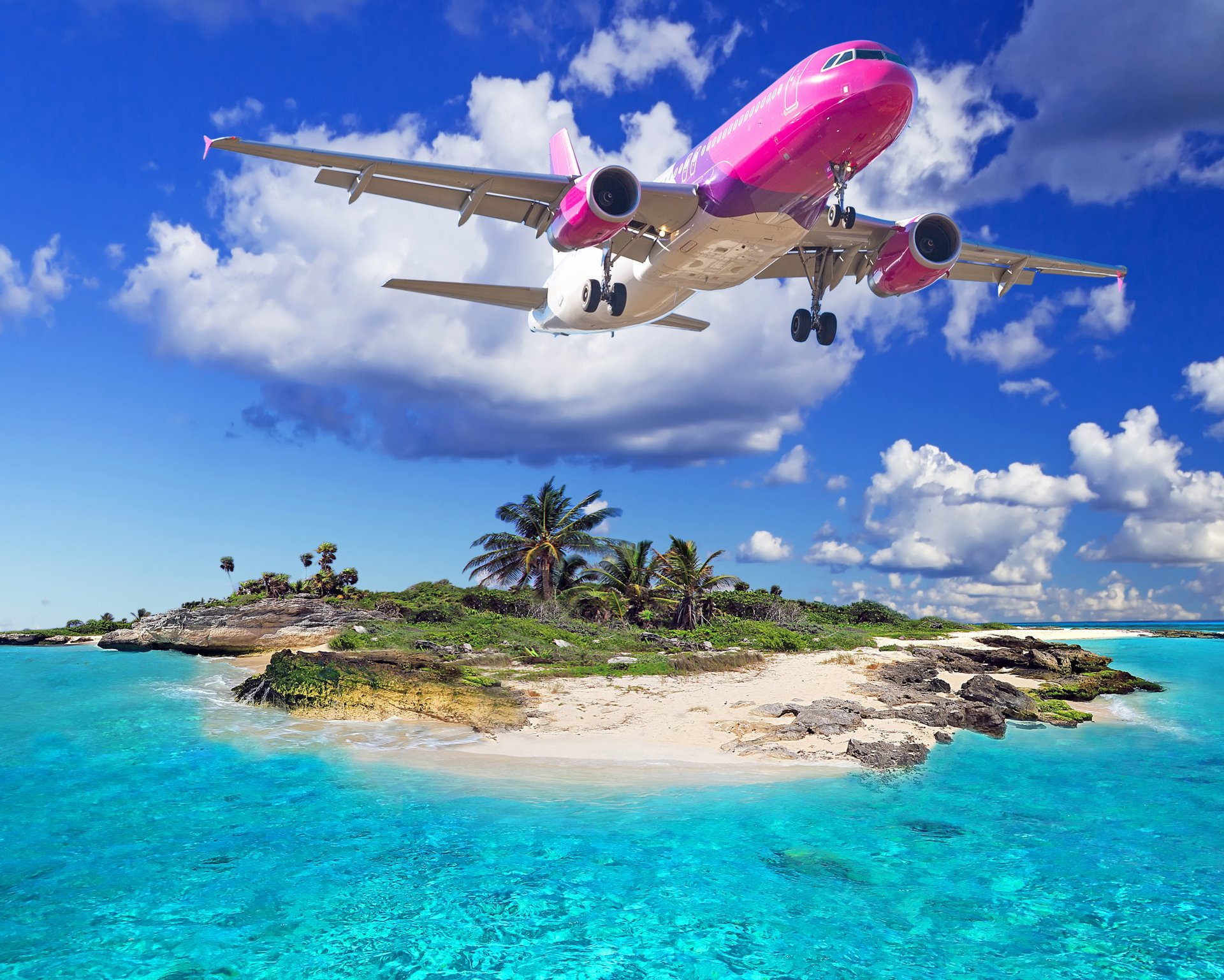 avion survolant l île tropiques plage mer survol de l île