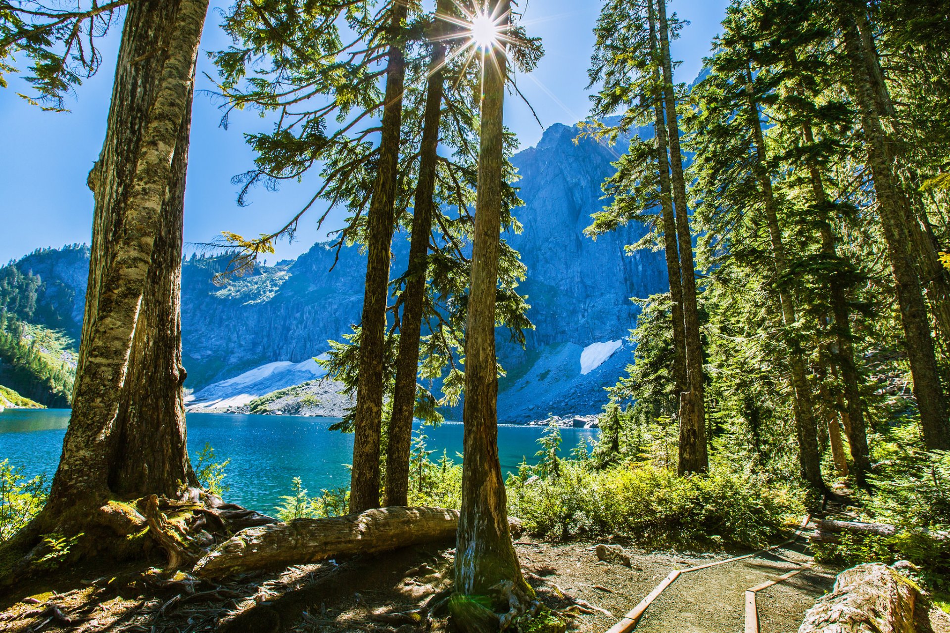 mountain tree lake sky sun rays stone