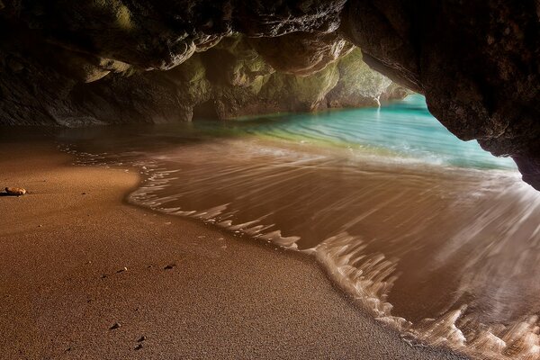 Sea beach in the rock grotto