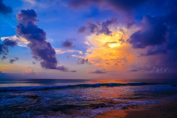 Sunset on the sea. Blue sky with lush clouds