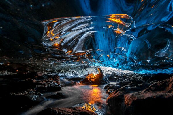 A man by the fire in an ice cave