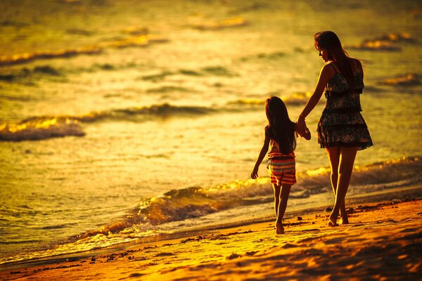 Mom and daughter on the seashore