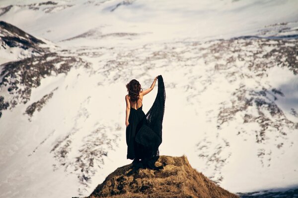 Girl in a dress on the mountain