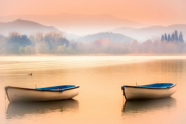 Boats with scrap in the lake in the mountains