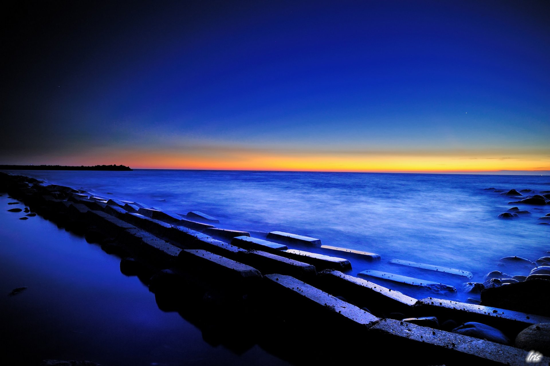 unset sea twilight sky stones power