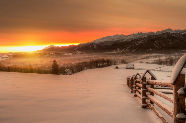 Winter dawn a village in the mountains