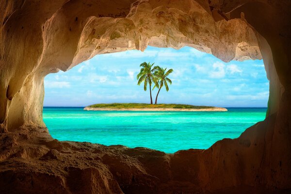 View from the grotto to the island with a palm tree