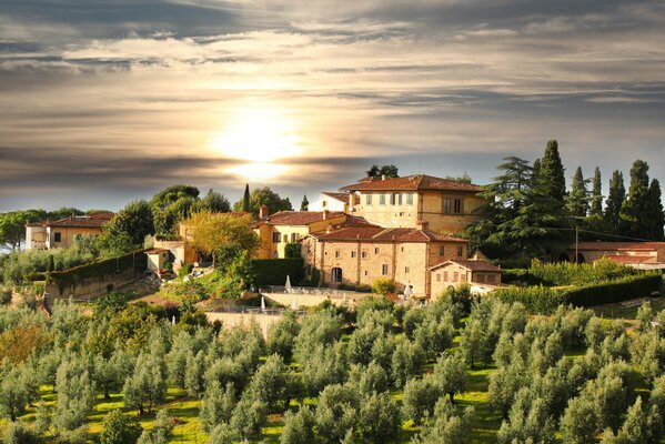 Landscape of a beautiful sunset in the clouds in Tuscany