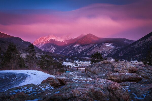 Pink sunset in snow-capped mountain peaks