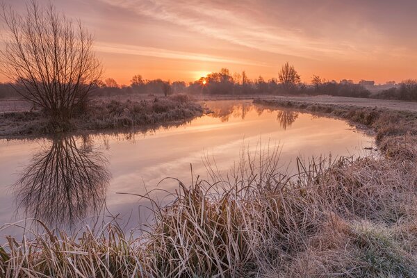 Cold dawn at the village river