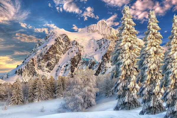 Winter landscape of mountains on the background of white clouds