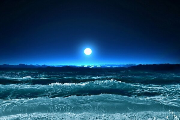 The glow of the moon over the waves of the ocean