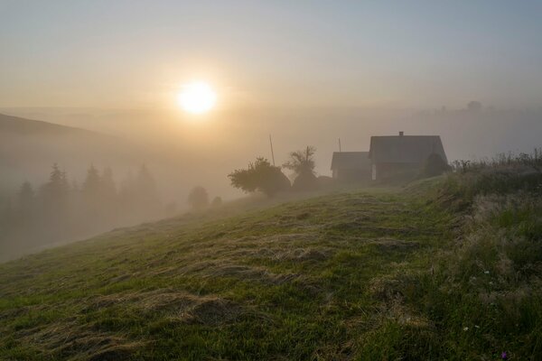 Houses in the fog in the Carpathian mountains