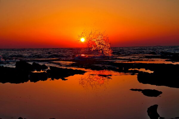 The moment of the wave surge at sunset