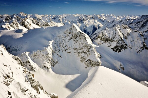 Snow-capped mountain peaks on a clear day