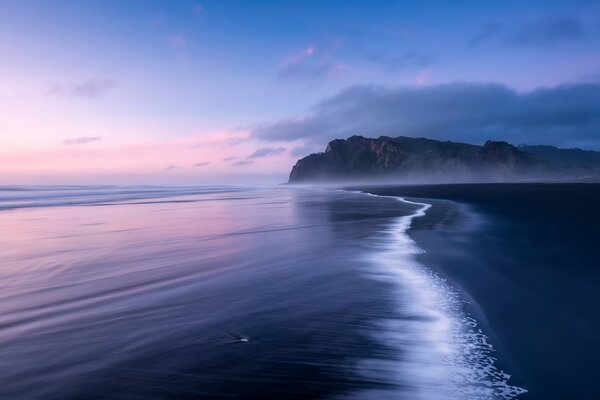 Sea surf on a rock background