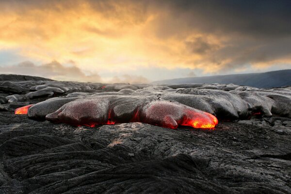 Volcano spews lava and spreads ash