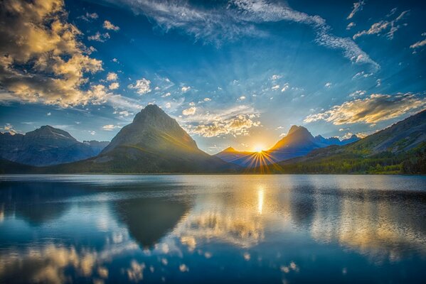 Landscape lake in the mountains magical sky