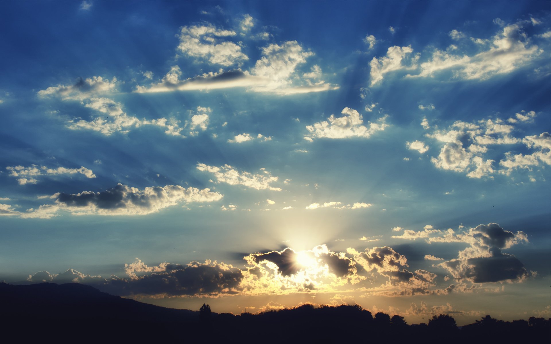 tramonto cielo nuvole colline silhouette